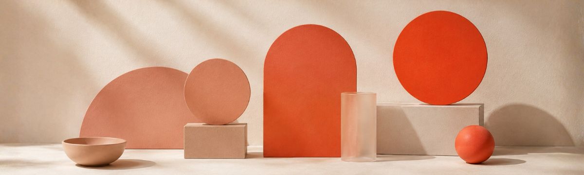Abstract composition showing a muted, medium and vivid coral-red hue at three levels of saturation.
